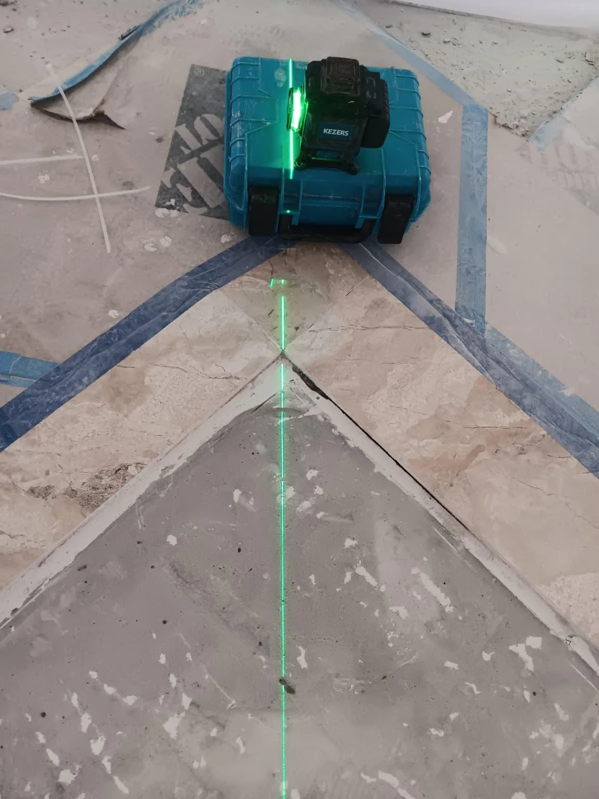 Laser level projecting a guide line on the floor