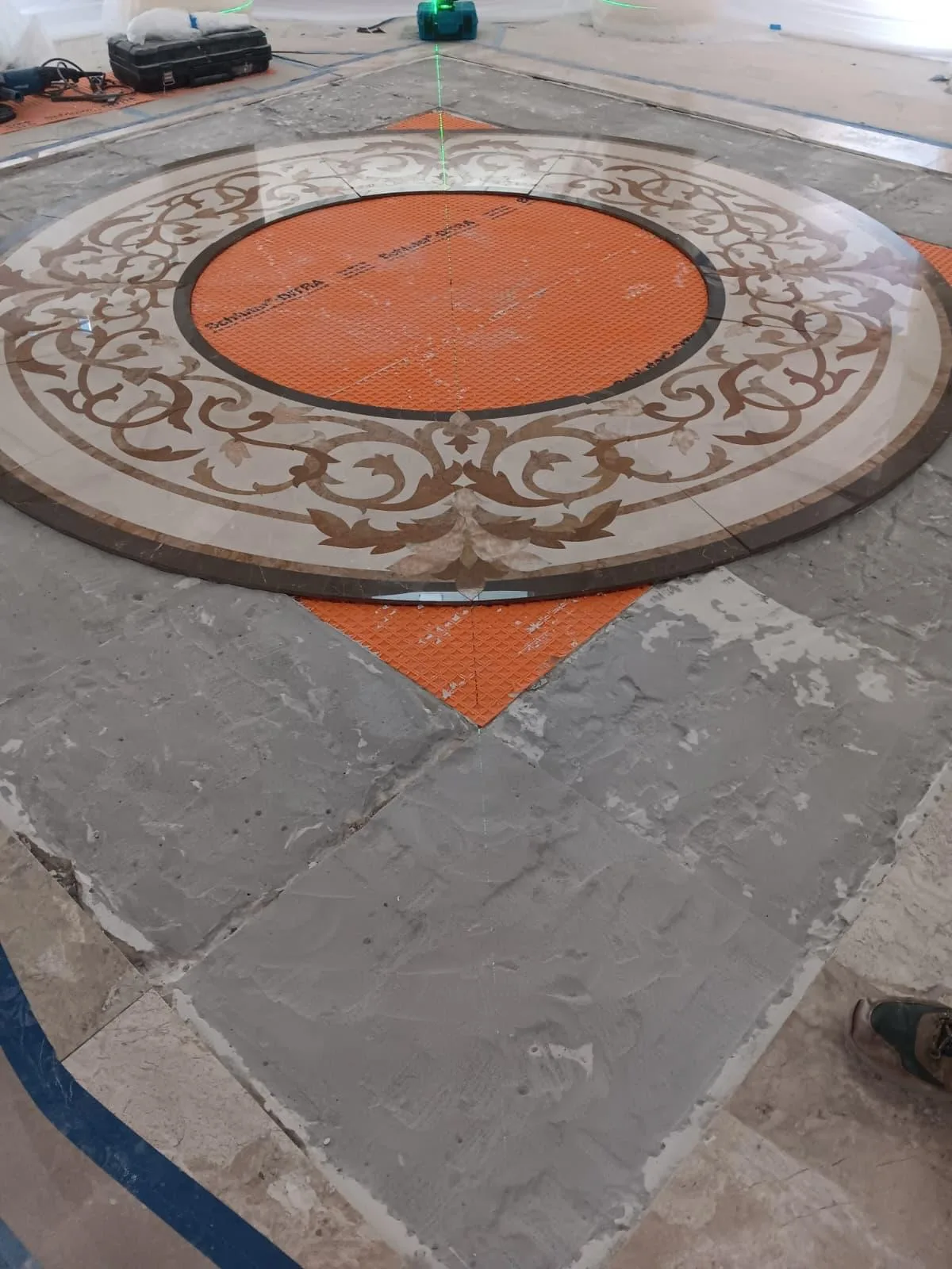 Close-up of the ornamental border of a round mosaic medallion
