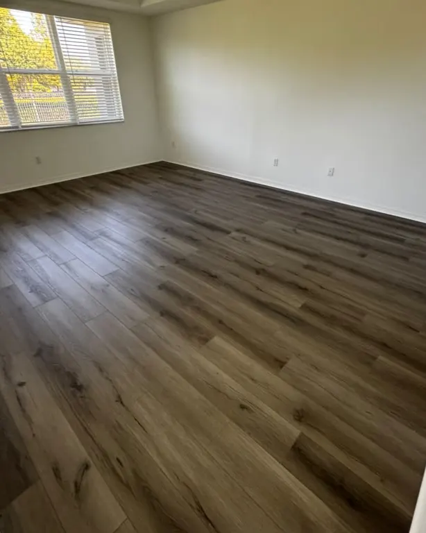 Finished: Dark wood-look plank flooring
