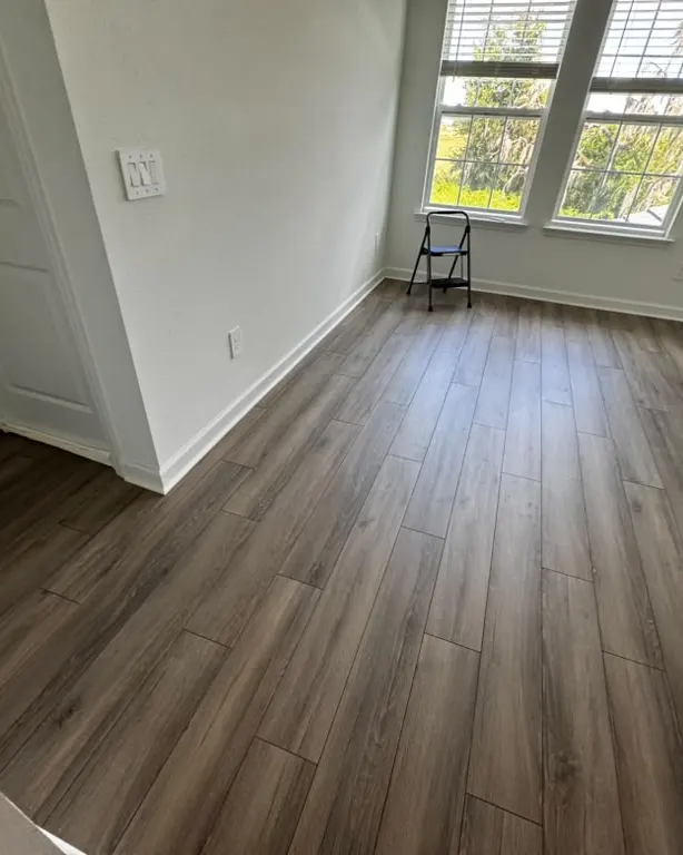 Finished: Dark wood-look plank flooring