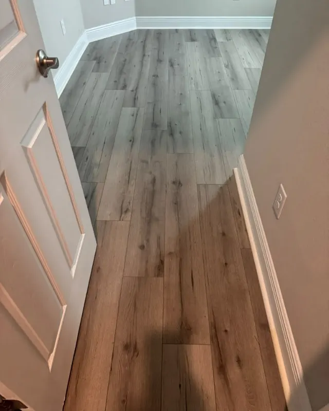 Finished: Gray and pale wood-look flooring