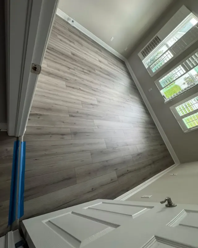 Finished: Gray and pale wood-look flooring