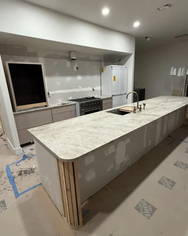 Before: Kitchen with brass hood & stone backsplash