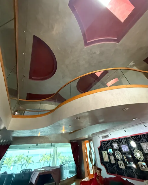 Before: Staircase hall with curved railing